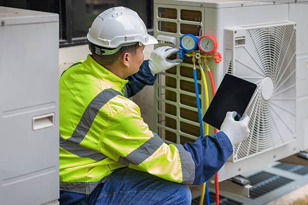 Professional Heat Pump Repair technician working in Valatie, NY